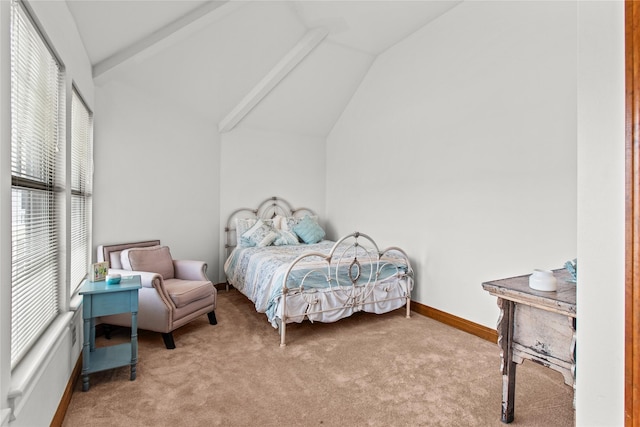 bedroom featuring lofted ceiling, light carpet, and baseboards