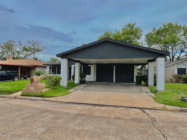 view of front of property with a front lawn and a carport