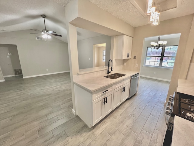 kitchen featuring stove, light hardwood / wood-style flooring, stainless steel dishwasher, vaulted ceiling, and white cabinetry