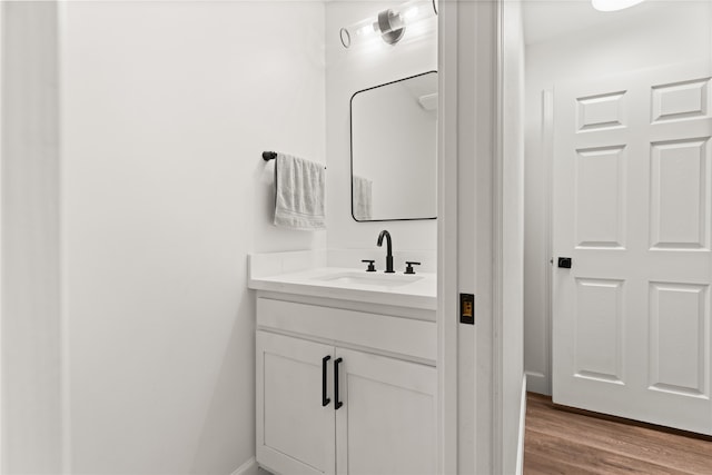 bathroom featuring hardwood / wood-style floors and vanity