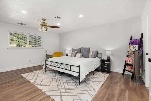 bedroom featuring ceiling fan and dark hardwood / wood-style floors