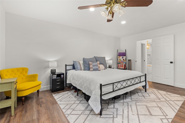 bedroom with hardwood / wood-style flooring and ceiling fan