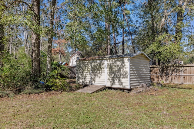 view of outdoor structure with a lawn