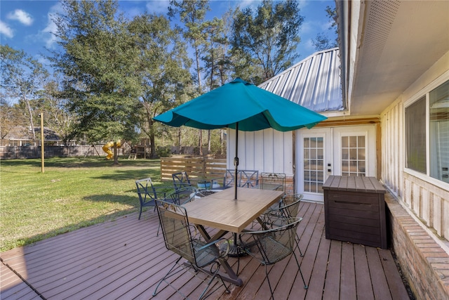 wooden terrace with a yard