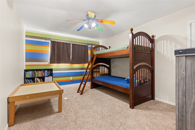 bedroom with ceiling fan and light colored carpet