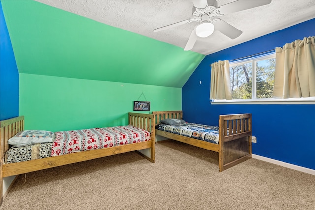 bedroom with carpet flooring, a textured ceiling, ceiling fan, and lofted ceiling