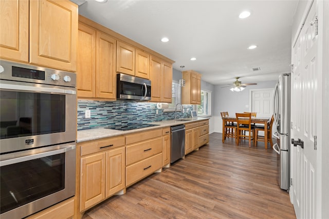 kitchen with ceiling fan, light brown cabinets, sink, appliances with stainless steel finishes, and hardwood / wood-style flooring