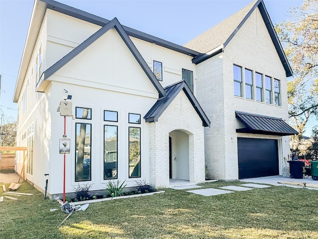 view of front facade with a front lawn and a garage