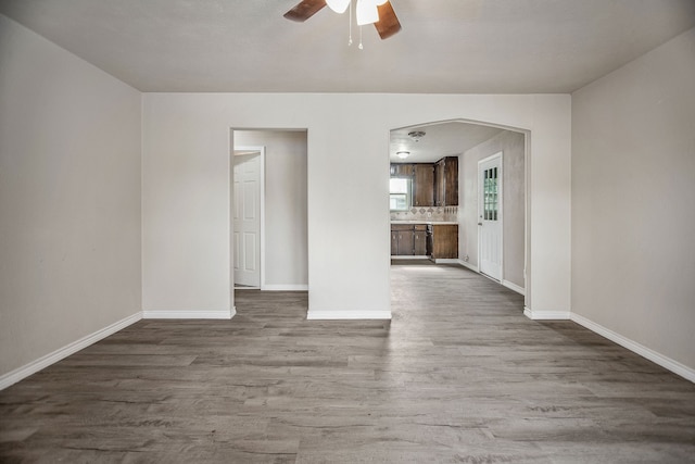 spare room featuring ceiling fan and wood-type flooring