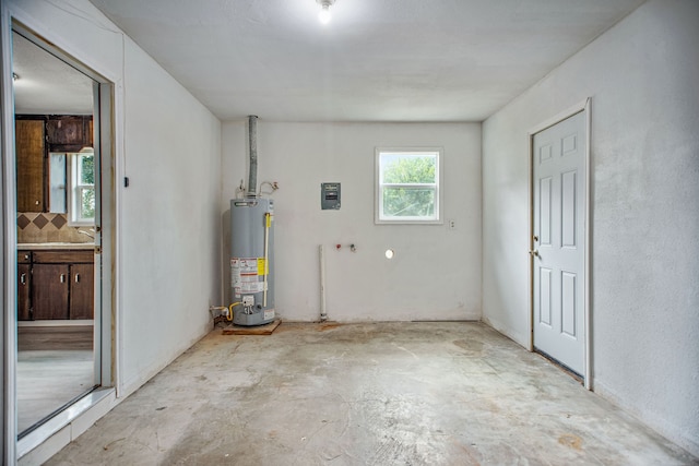 laundry room featuring gas water heater