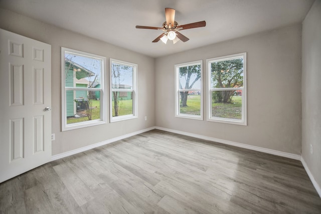 unfurnished room with light hardwood / wood-style floors and ceiling fan