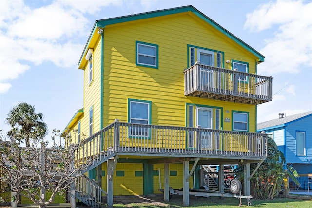 rear view of house with a wooden deck