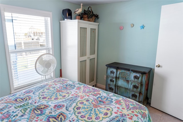 bedroom with light tile patterned floors