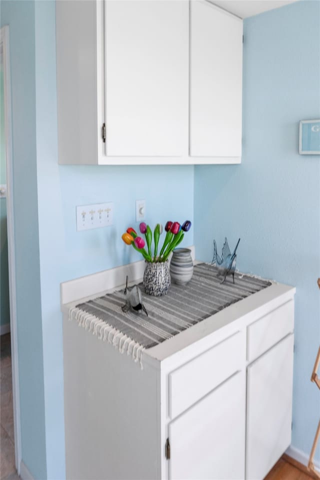 kitchen featuring white cabinets