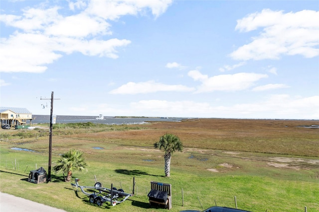 birds eye view of property with a water view and a rural view