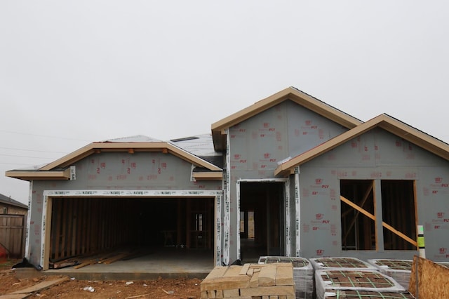 property in mid-construction featuring a garage