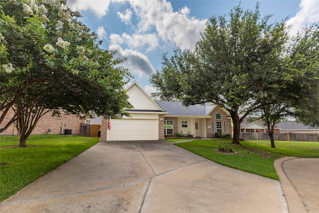 view of front facade featuring a front yard and a garage