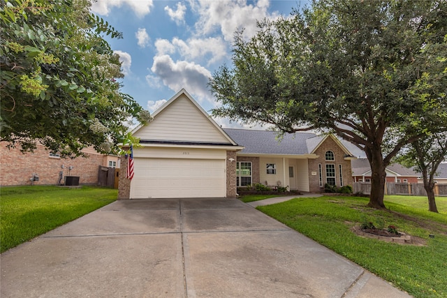 ranch-style home featuring a front lawn and a garage