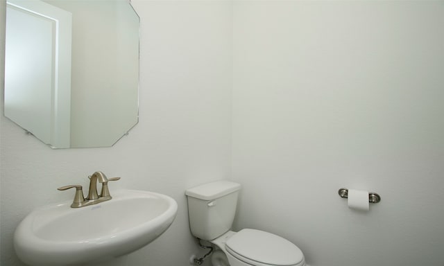 bathroom with sink and toilet