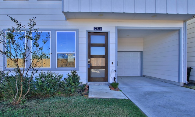 doorway to property featuring a garage