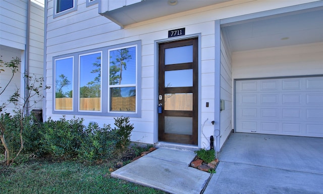 property entrance featuring a garage