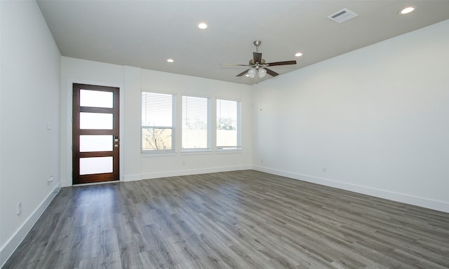 unfurnished room with dark hardwood / wood-style floors and ceiling fan