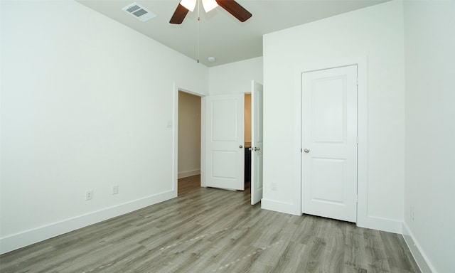 unfurnished bedroom with light hardwood / wood-style floors and ceiling fan