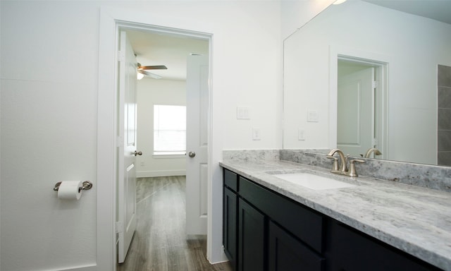 bathroom featuring vanity, hardwood / wood-style flooring, and ceiling fan