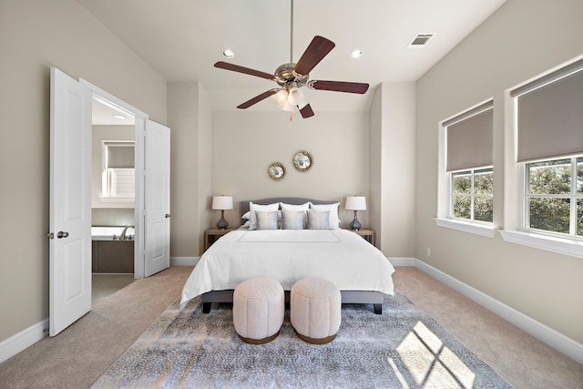 bedroom with ceiling fan and light carpet