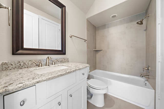 full bathroom with vanity, toilet, and tiled shower / bath