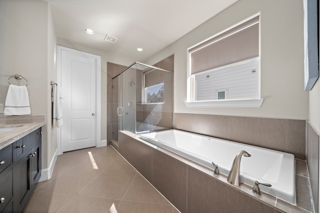 bathroom with separate shower and tub, tile patterned floors, and vanity