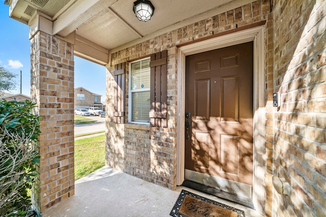 property entrance featuring a porch