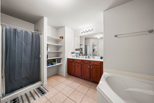 bathroom featuring vanity, shower with separate bathtub, a textured ceiling, and tile patterned floors