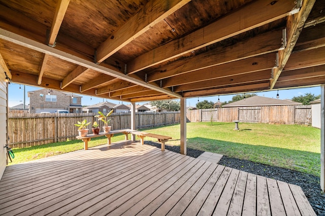 wooden terrace featuring a lawn