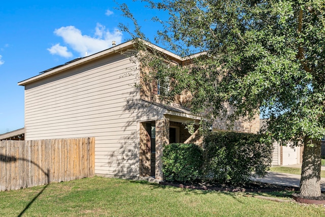 view of home's exterior featuring a lawn