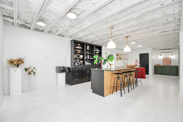 bar with a wall unit AC, sink, and hanging light fixtures