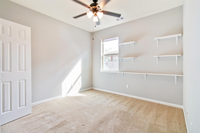 carpeted empty room with ceiling fan