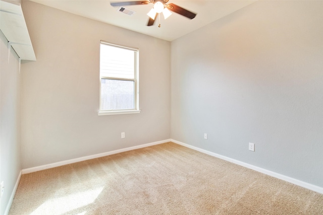 empty room featuring carpet floors and ceiling fan