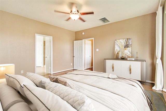 bedroom featuring hardwood / wood-style floors and ceiling fan