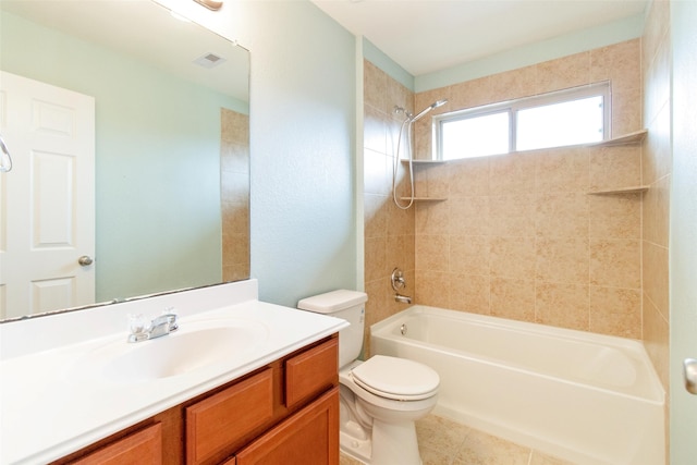 full bathroom featuring tile patterned floors, vanity, toilet, and tiled shower / bath