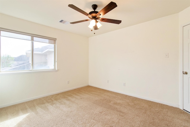 empty room with ceiling fan and light colored carpet