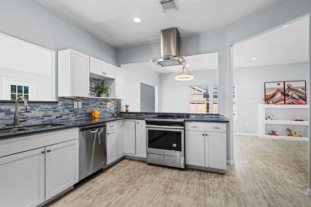 kitchen with white cabinets, sink, light hardwood / wood-style flooring, island range hood, and stainless steel appliances