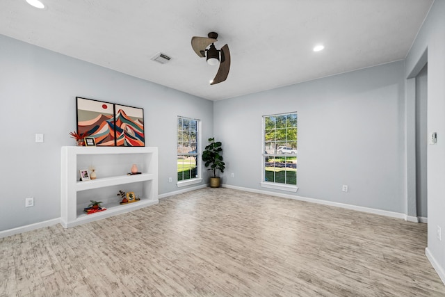 interior space featuring light wood-type flooring and ceiling fan