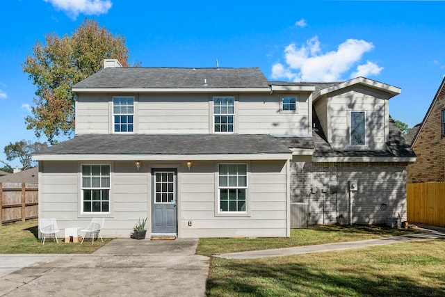 view of front of property with a patio area and a front yard