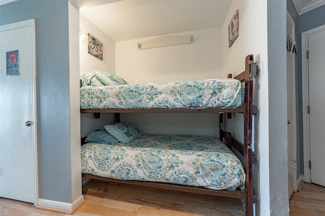 bedroom with hardwood / wood-style floors