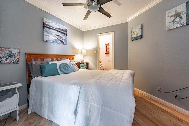 bedroom with ceiling fan, ornamental molding, and light wood-type flooring