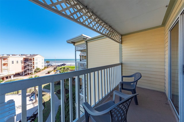 balcony featuring a water view