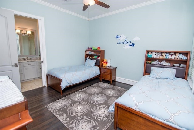 bedroom featuring ensuite bathroom, sink, dark hardwood / wood-style floors, ceiling fan, and ornamental molding