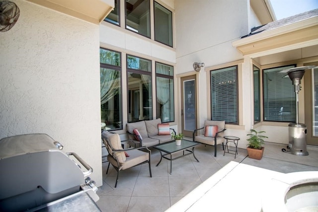 view of patio featuring outdoor lounge area and a grill