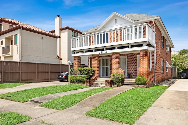 view of front of house with a porch and a balcony